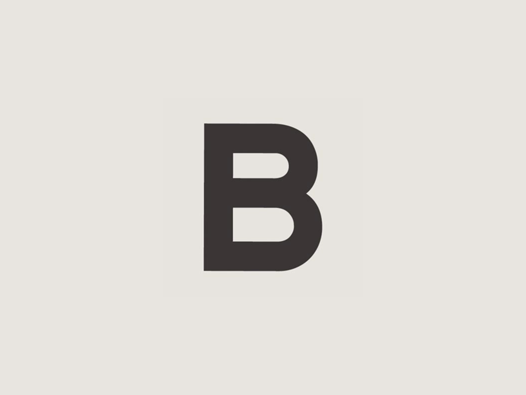 The 'B' from Brown's Hotel's logo isolated on an off-white background
