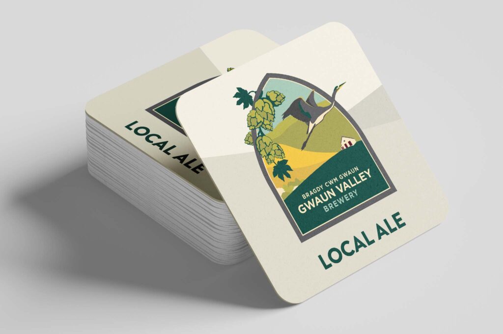 Beer mats featuring the logo we designed for Gwaun Valley Brewery which features colours and graphic elements referencing the Pembrokeshire landscapes