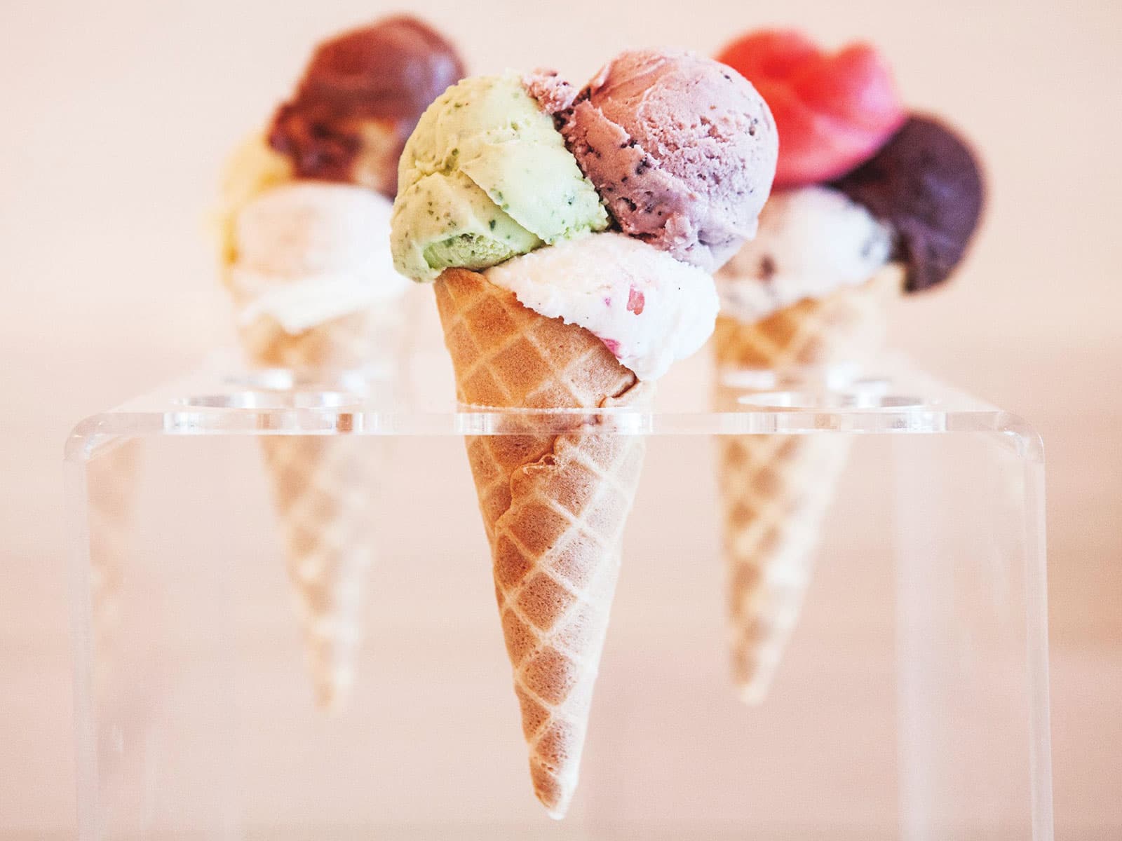 Three waffle cones with gelato