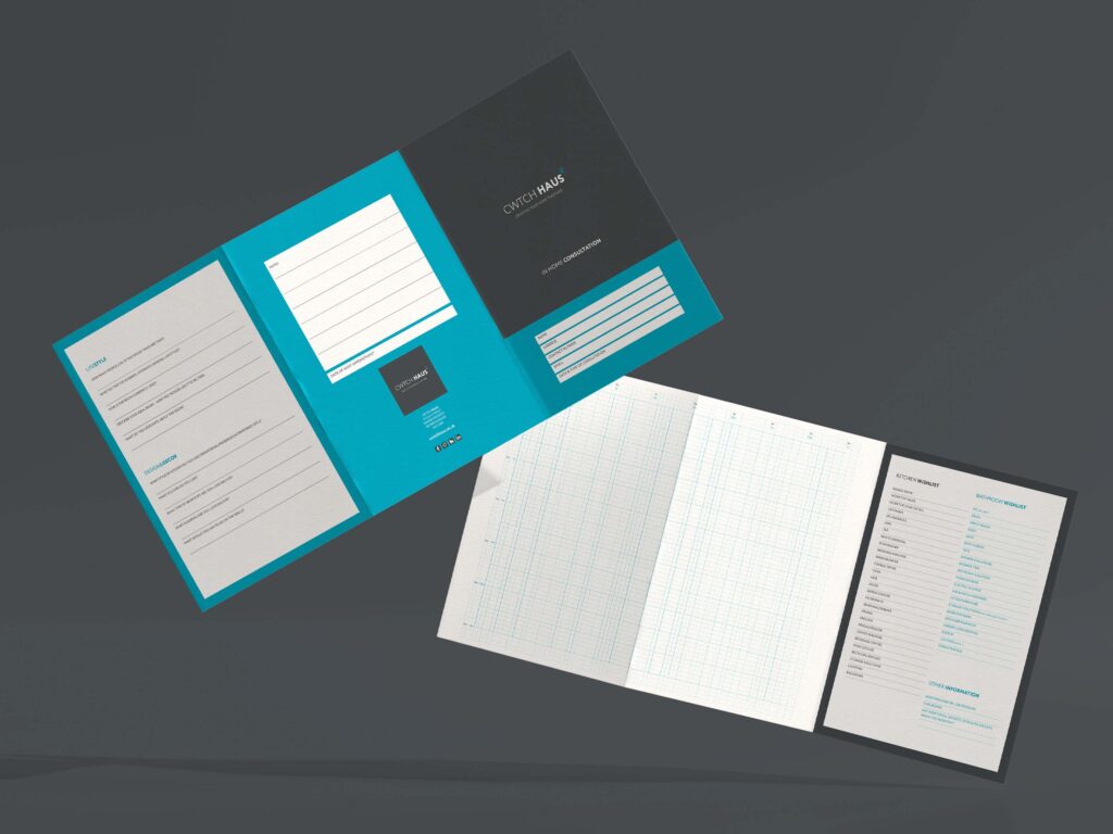 A grey background with two tri-fold leaflets in blue, white and grey