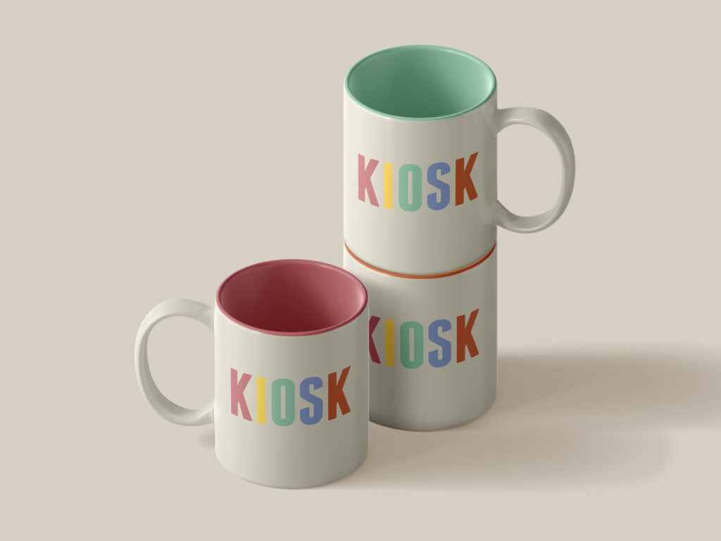 3 mugs with the KIOSK logo written on them in five different colours