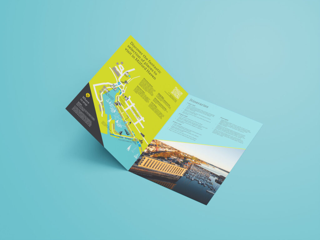 An inside view of a turquoise leaflet design with vibrant lime green and grey elements