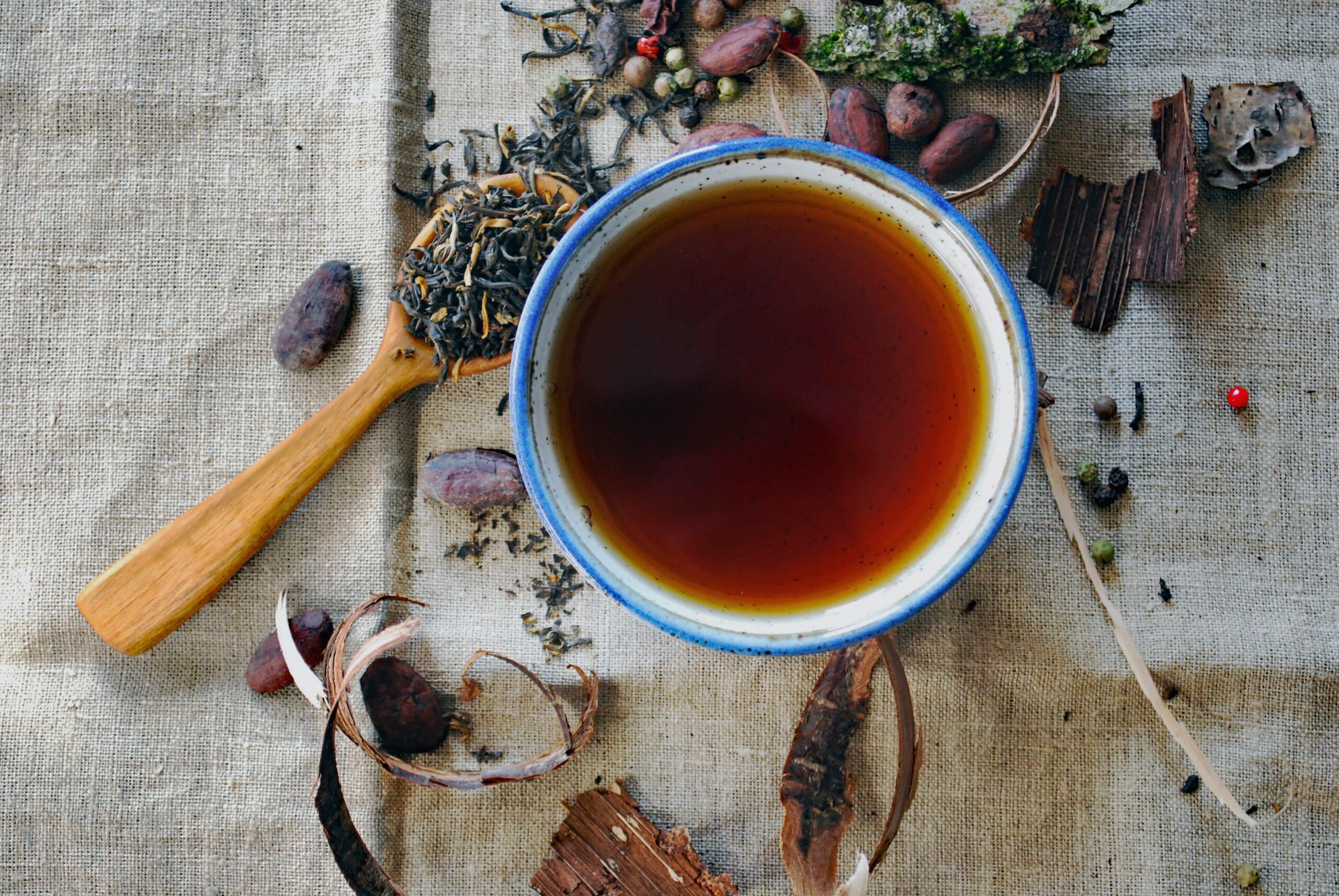 An overhead image of a cup of black tea