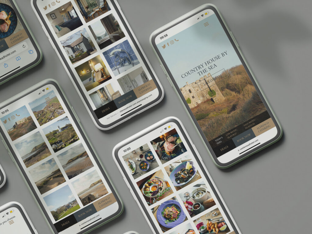 A flatlay of iphones with the Castlemead hotel website showing different pages
