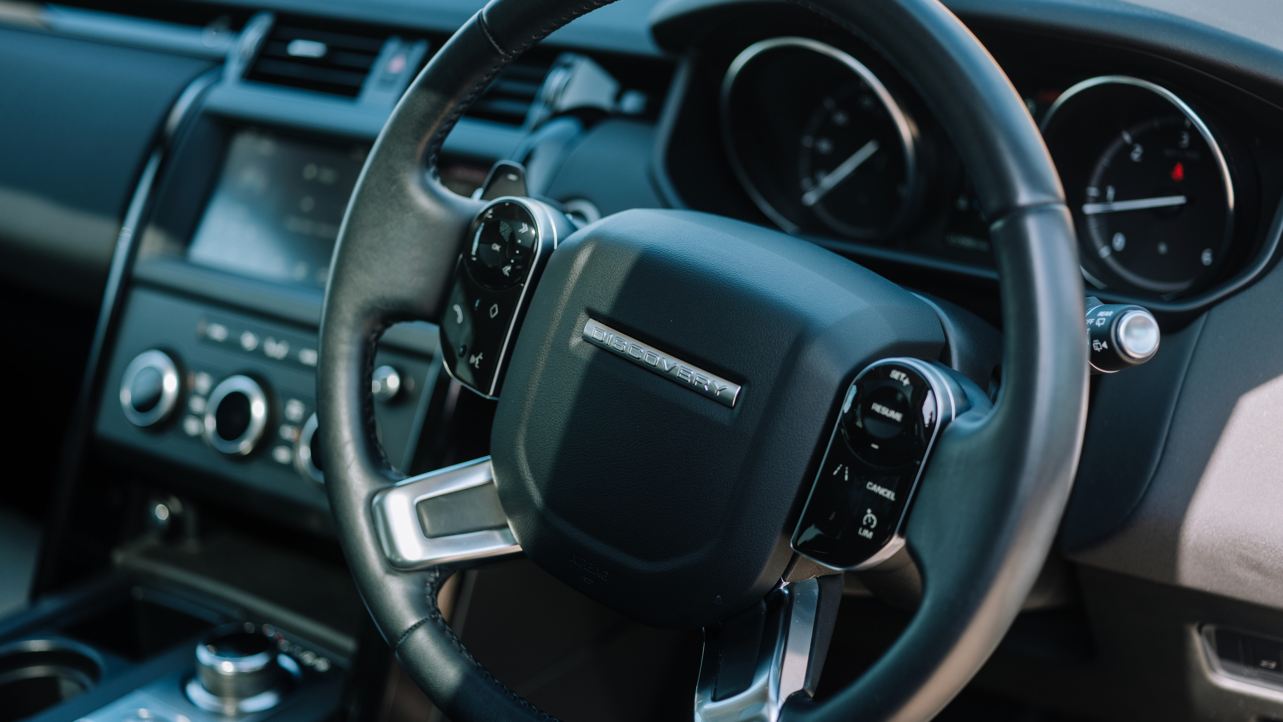 A close up of a steering wheel in a vehicle